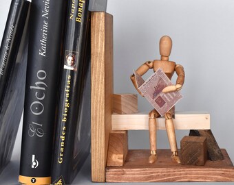Wooden bookends with articulated puppet.