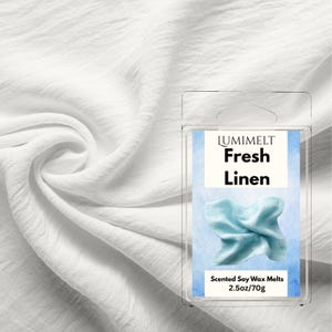 May include: A white, textured fabric background with a clear plastic package containing scented soy wax melts. The package label reads "LUMIMELT Fresh Linen" with a light blue wax melt image. The package contains 2.5oz/70g of wax.