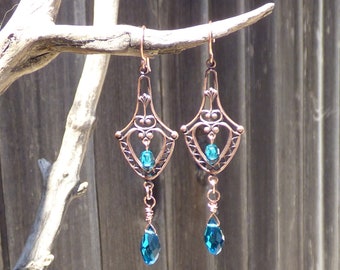 Copper ox filigree dangle drop earrings of teal glass and Austrian crystal beads on raw copper wire with copper ear wires