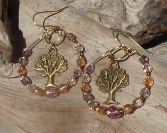 Hand bent raw brass earrings with lavender, peach and pink glass beads and antique brass tree dangles