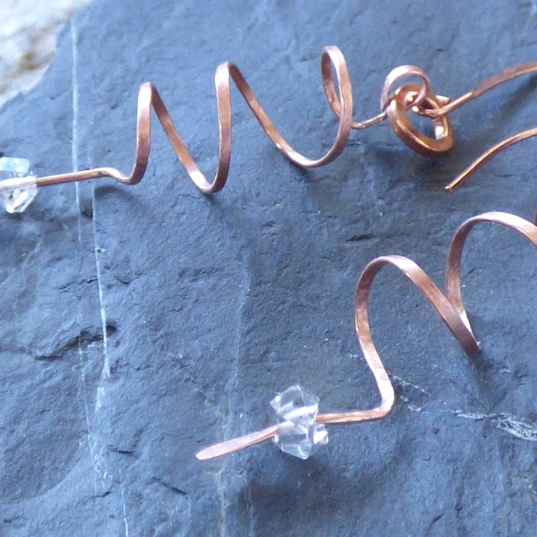 Hammered and hand bent spiral raw copper earrings with herikimer diamonds and copper ear wires