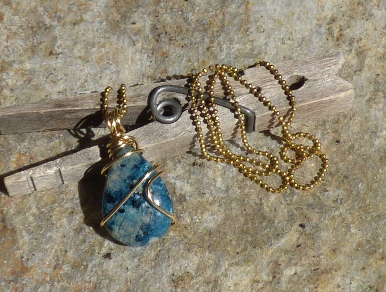 Petite sky blue cherry jasper tear drop wire wrapped pendant in raw brass with an 18 brass ball chain
