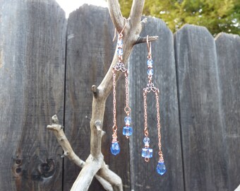 Delicate copper earrings with light blue crystal cubes and drops and twisted curb chain dangles