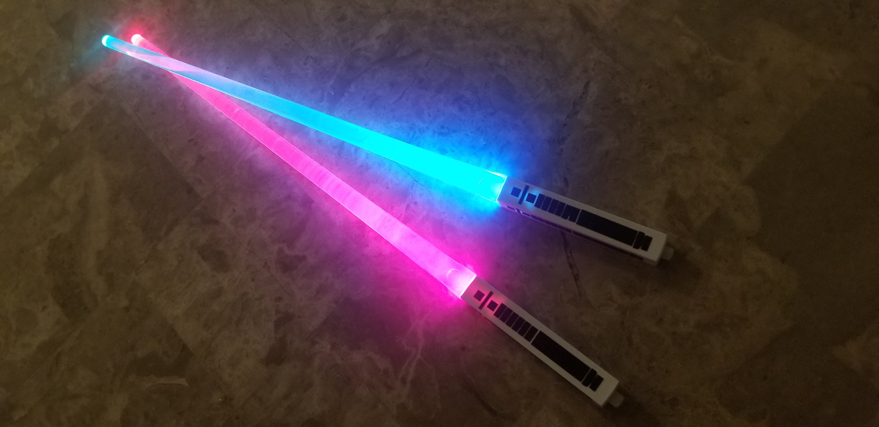 Pink and 2025 blue lightsabers