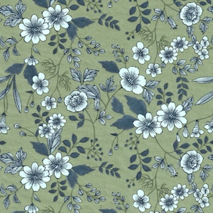 Pode incluir: Um tecido verde com um padrão floral branco. As flores são estilizadas e têm um aspeto vintage. O tecido é perfeito para projetos de artesanato, quilting ou para fazer roupa.