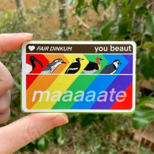 May include: A rainbow sticker with the text "you beaut maaaaate" and a heart with the text "FAIR DINKUM". Five different birds are illustrated on the sticker.
