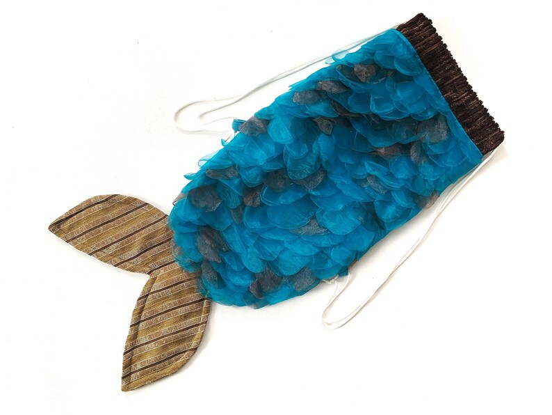 May include: A blue and brown mermaid tail costume with a tulle skirt and a brown fabric tail fin.