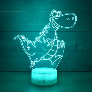 Lampa w kształcie dinozaura T-Rex idealna dla fanów dinozaurów, zarówno młodych, jak i starszych. Lampa LED z 16 kolorami i 4 opcjami.