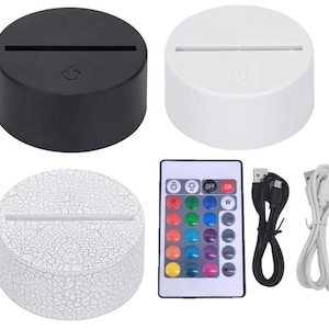 Puede incluir: Tres luces nocturnas LED redondas blancas y negras con un cable USB y un mando a distancia con 16 opciones de color. El mando a distancia tiene botones para encender, apagar, flash, estroboscópico, fundido y suave.
