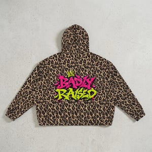 Sudadera con capucha y cremallera con estampado de leopardo estilo Y2K, chaqueta grafiti extragrande, ropa urbana unisex, moda alternativa.