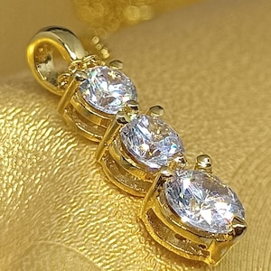 Simulated Diamond Journey Pendant: 14k Yellow Gold Plated Sterling Silver
