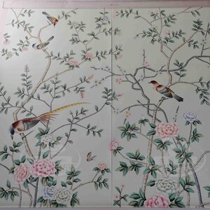 May include: Two-panel wallpaper featuring a detailed botanical design with birds and flowers. The artwork showcases a light green background with branches, leaves, and various birds. Pink and white flowers add color to the design.
