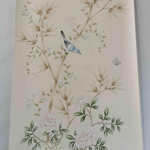 Hand-painted chinoiserie wall panels featuring bamboo, birds, and white peonies on ivory silk, custom artwork in a soft green garden landscape