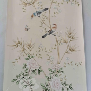 Hand-painted chinoiserie wall panels featuring bamboo, birds, and white peonies on ivory silk, custom artwork in a soft green garden landscape