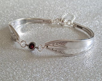 Vintage cutlery bracelet with a red diamanté connector, safety chain and magnetic clasp.