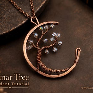 May include: A copper wire pendant shaped like a crescent moon containing a wire-wrapped tree with small iridescent beads as leaves. The pendant hangs from a matching copper chain. The text Lunar Tree Pendant Tutorial is visible at the bottom.
