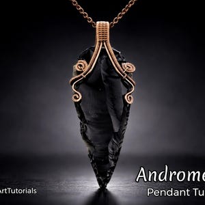 May include: A handcrafted pendant featuring a dark, obsidian-like stone, wire-wrapped in copper. The pendant has a teardrop shape with intricate wire detailing. The text "Andromeda Pendant Tutorial" is visible.