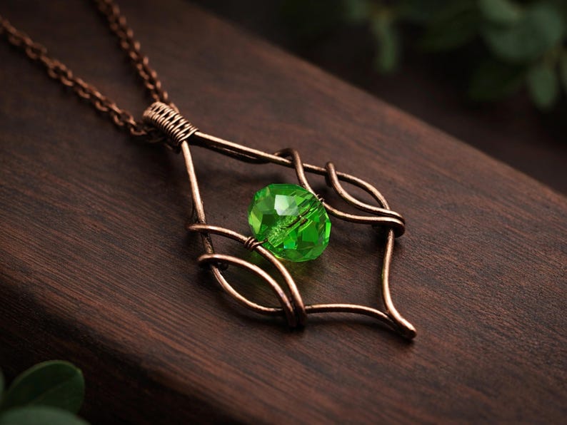 Tutorial WireArtTutorials per realizzare un ciondolo a tulipano in velluto con filo metallico, schema di tessitura, creazione di gioielli fai da te, tutorial di wire art, design di collana di perline immagine 2