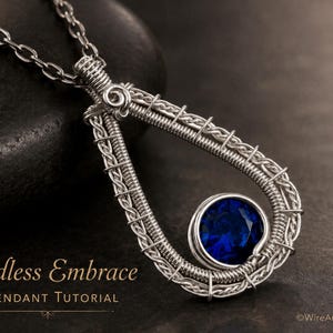May include: A silver-toned wire-wrapped pendant featuring a teardrop-shaped frame and a single round, faceted deep blue gemstone. The pendant hangs from a matching silver-toned chain. Text on the image reads: Endless Embrace Pendant Tutorial.