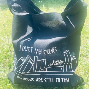 I dust my shelves but my books are still filthy… Tote Bag