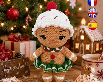 May include: A crocheted gingerbread doll featuring a tan body, a white hat with pink and brown sprinkles, a red pom-pom, a green and white ruffled skirt, and a red and green scarf. The doll has black eyes, long eyelashes, and a small pink mouth.