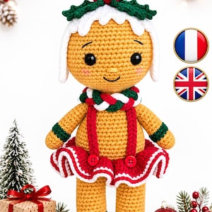 May include: A crocheted gingerbread doll featuring a tan body, a red and white ruffled skirt with two red buttons, a braided red, white, and green scarf, and a white icing-style hat topped with a red pom-pom and green holly leaves.