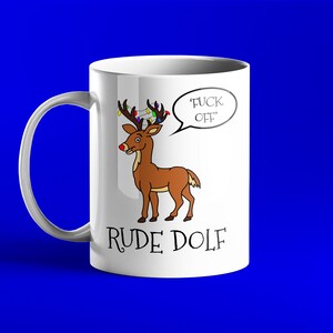 May include: White ceramic mug with a cartoon reindeer wearing Christmas lights and a speech bubble that says "F*CK OFF". The text "RUDE DOLf" is printed below the reindeer.