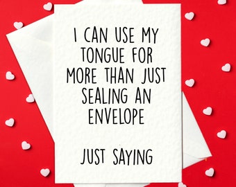 May include: A white card with black text that reads "I can use my tongue for more than just sealing an envelope. Just saying." The card is on a red background with white hearts scattered around it.