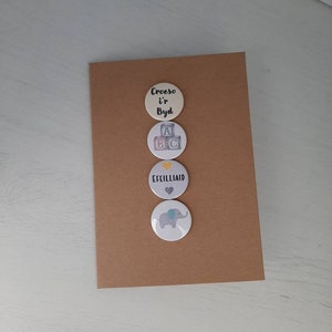 Cerdyn genedigaeth efeilliaid. Welsh twins card.