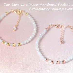 May include: Two delicate bracelets with white beads and gold or rose gold accents. The bracelets are on a pink background.
