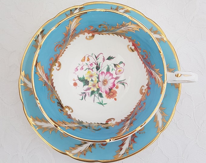 Paragon Tea Cup and Saucer, Floral Center, Gold Feather Pattern on Eggshell Blue, Made in England