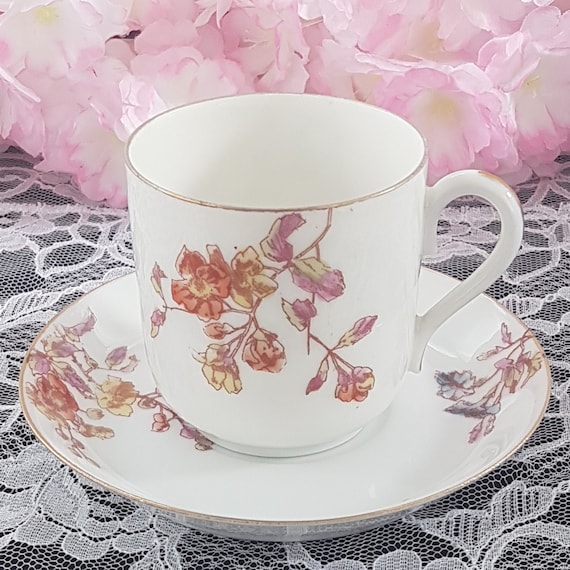 Antique Limoges Porcelain Cup and Saucer: Hand Painted Floral Design, France (1890-1902)