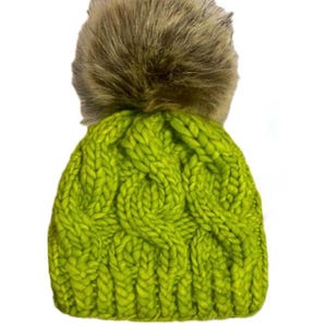 May include: A bright green knitted beanie with a large brown faux fur pom pom on top.