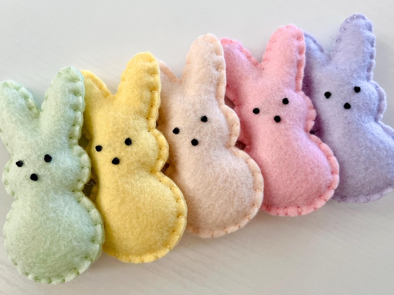 Pastel colored felt bunnies with puffy tail on back