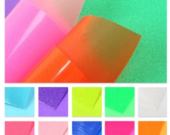 May include: A variety of 12 colors of glitter iron-on vinyl. The colors include light blue, purple, neon yellow, neon green, white, pink, light pink, blue, hot pink, orange, and green.