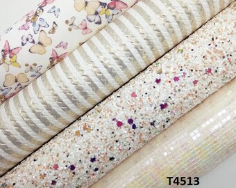 May include: Four rolls of fabric with different patterns. The first roll has a white background with a pink and white butterfly pattern. The second roll has a white background with gold stripes. The third roll has a white background with small, colourful glitter. The fourth roll has a white background with an iridescent, square pattern. The text "T4513" is visible in the bottom right corner.