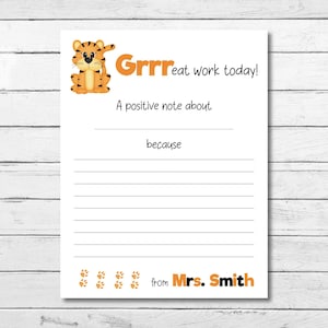 May include: A white sheet of paper with a cartoon tiger and the orange text "Grrr eat work today!". It has lines for writing, with the phrases "A positive note about" and "because". The bottom right corner says "from Mrs. Smith".