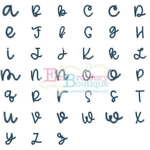 May include: A set of uppercase letters in a handwritten font, embroidered in dark blue thread. The letters are arranged in alphabetical order.