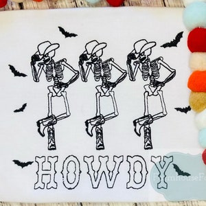 May include: Three skeletons wearing cowboy hats and boots are dancing with the word "HOWDY" below them. Bats are flying around the skeletons.