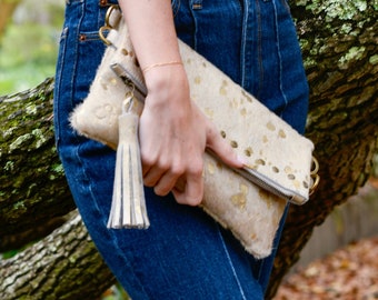 Handmade hair-on cowhide fold over bag with a Tassel, Antique gold boho chic style clutch.