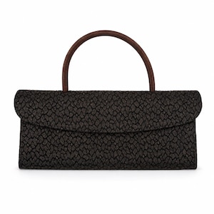 May include: A rectangular black handbag with a brown handle. The bag has a textured pattern and a flap closure. The handle is arched and made of a darker brown material.