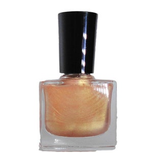 May include: A bottle of gold shimmer nail polish with a black cap.