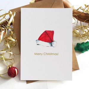 Weihnachtskarten. Weihnachtsmütze Karten. Weihnachtsmannmütze. Original Handgemalte Karten. Minimalistische Feiertags-Grußkarten