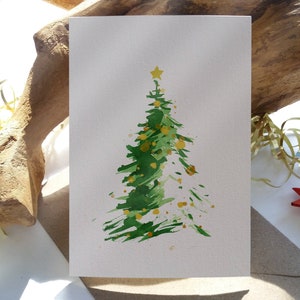 Abstracte altijdgroene kerstboomkaarten. Kaartenset. Origineel met de hand beschilderd. Gevouwen lege minimalistische vakantie wenskaart.