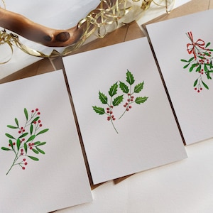 Carte botaniche - Set di 3 cartoline natalizie assortite - Vischio a nastro, foglie di agrifoglio, vischio minimalista - Originalmente dipinte a mano.