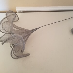 African shaped wire flower, iris, lily