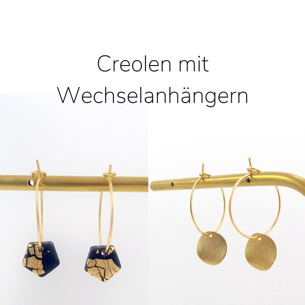 2-in-1 Creolen. Goldene Creole mit Wechselanhängern. Creole mit 2 verschiedenen Anhängern: schwarz. 18 Karat Gold Creolen. Goldene Creolen.