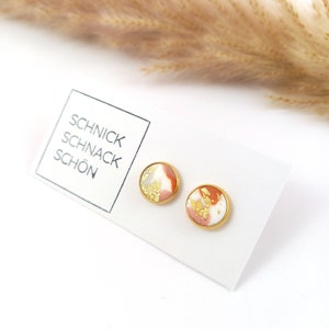 Gold stud earrings. Pink copper earrings in gold settings. Small pink copper stud earrings. Gold copper stud earrings. Beautiful knick-knacks.