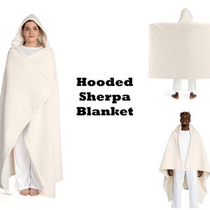 a woman wearing a hooded sherpa blanket
