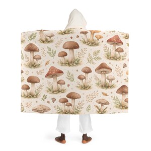 May include: A set of three ceramic mugs with a speckled, matte finish. The mugs are in cream, light grey, and dark grey. Each mug has a simple, minimalist design, ideal for coffee or tea.